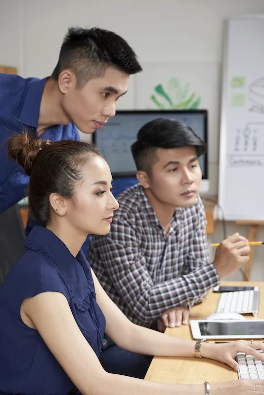 a group of people studying professional MBA online from UTM